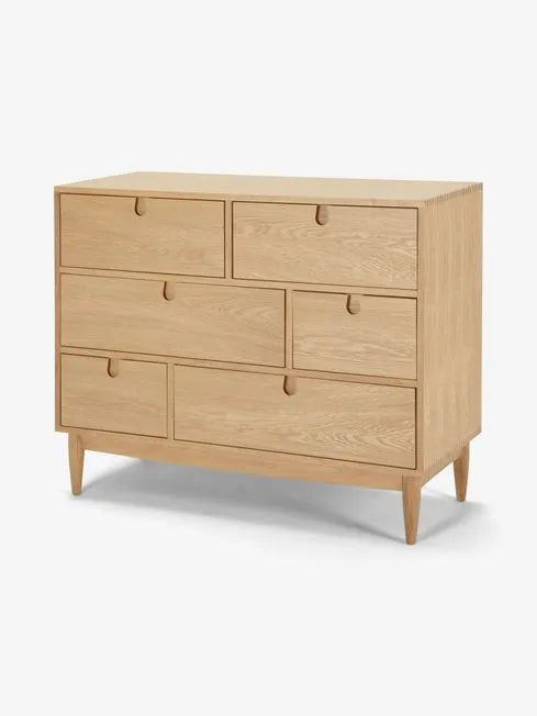 Oak Wood Dresser With Asymmetrical Drawer Layout And Tapered Legs
