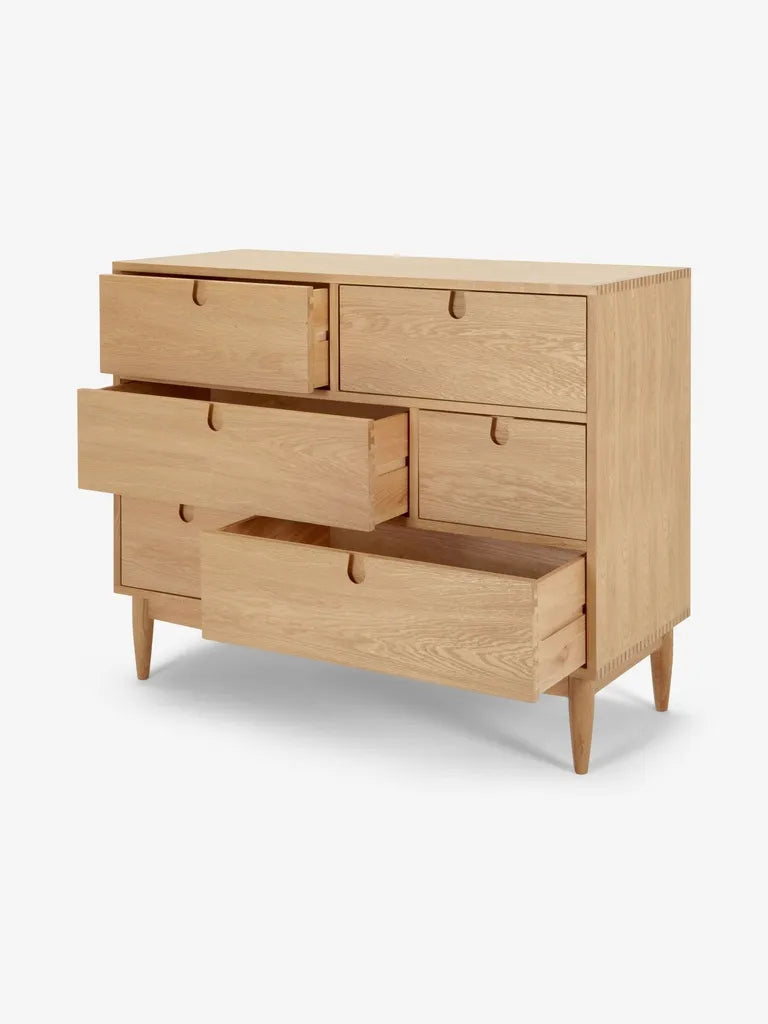 Oak Wood Dresser With Asymmetrical Drawer Layout And Tapered Legs